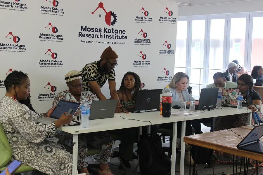 Participants working together on laptops at a Tech Horizons event.